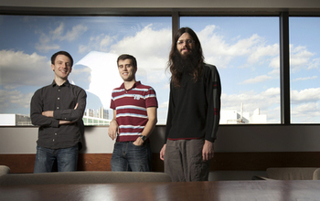 gradute students , Francois Hebert, Andy Bohn and William Throwe standing in a classroom